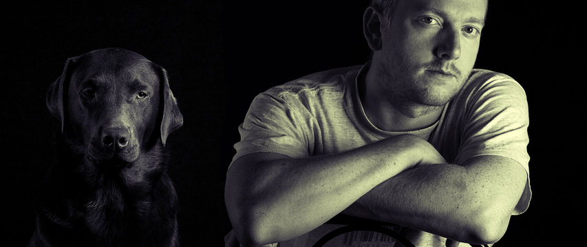 Shot of a Male Owner with his Labrador Retriever