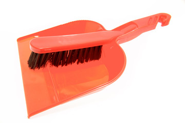 Brush and dustpan on white background