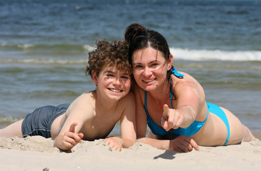 Fototapeta premium Mum and son on the beach