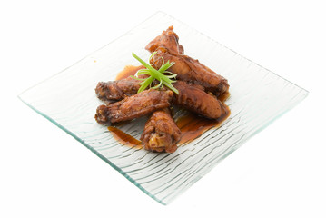 wings of chicken on plate and white background