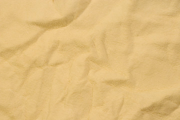 Fototapeta na wymiar Beige chamois leather looking like old paper or sand