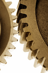 Two gears over white background