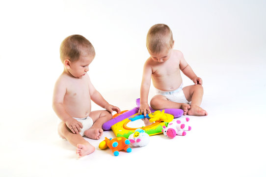 Baby twins playing