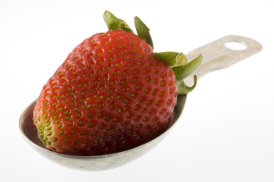 strawberry on measuring tablespoon