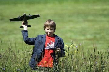 Boy playing with the remote control plane.