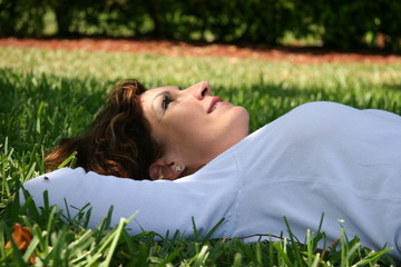girl lying on the grass