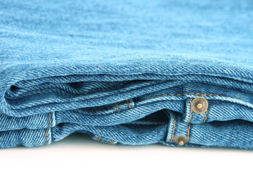 Close up folded blue jeans