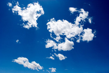 Fototapeta na wymiar Beautiful white clouds over blue sky