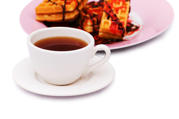 Tea and belgian waffles isolated on the white