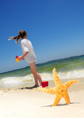 Starfish and girl on beach