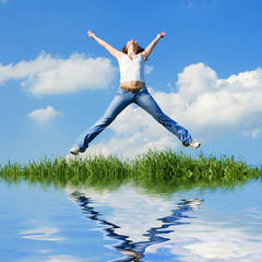 happy young woman is jumping
