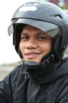 man with helmet smiling