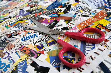 Scissors on Magazine Clipping Background