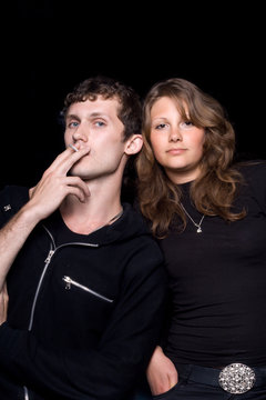 The young couple. Isolated on a black background