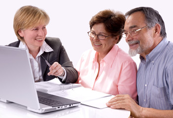 Mature couple talking to financial planner at home