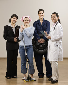 Young women dressed in various occupational clothing