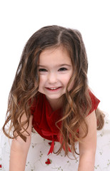 Beautiful little girl in a red and white holiday dress.