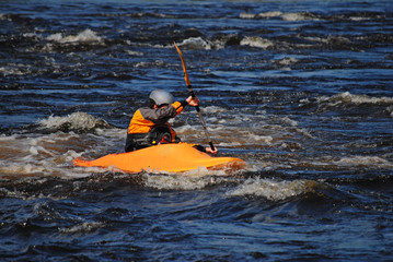 Kayaker in a yellow boat