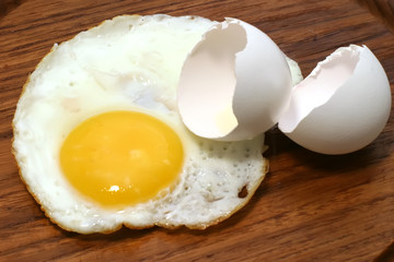 fried egg on wooden plate