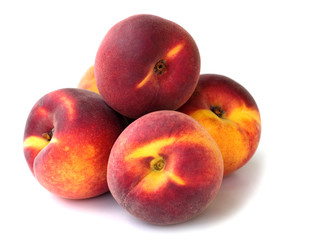 fresh peaches on white background