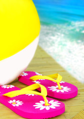 Flip Flops and Beachball by Ocean