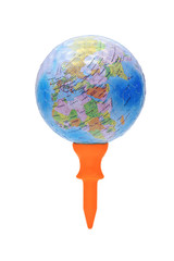 Globe on orange golf tee