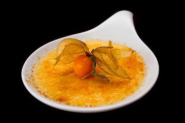 ginger creme brulee isolated on black
