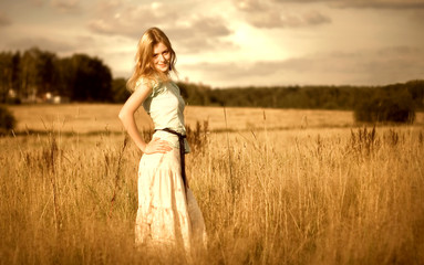 Beautyful woman in summer field