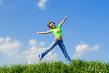 expressive young woman is jumping