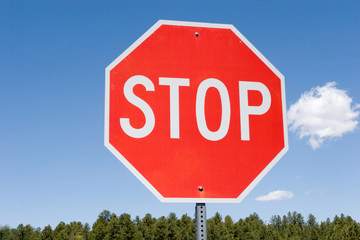 Stop sign against blue sky