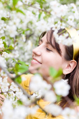 Young woman with spring cherry flowers