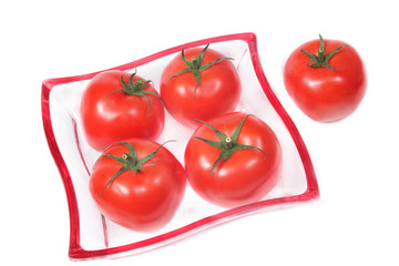 Tomatoes on a glass plate.