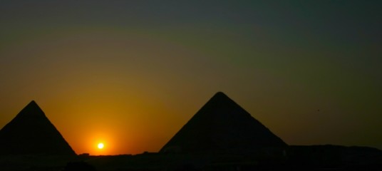 Fototapeta na wymiar Sunset over gizah pyramids - Cairo