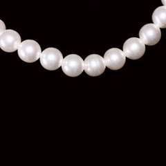 white pearls on black