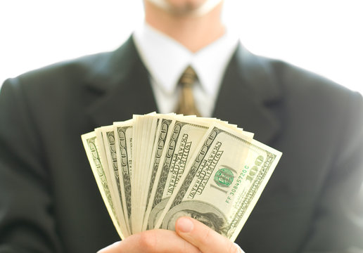 money in hand of businessman