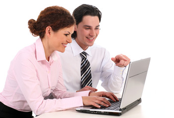 Obraz premium Businesswoman and businessman working on laptop computer