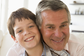Grandfather and grandson smiling