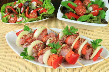 Shish-kebab and salads