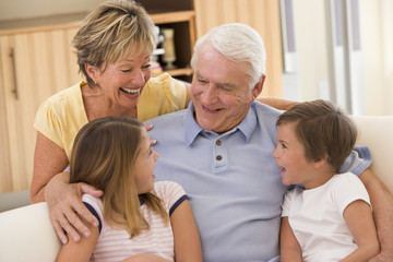 Grandparents laughing with grandchildren