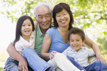 Grandparents laughing with grandchildren