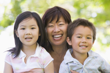 Grandmother laughing with grandchildren