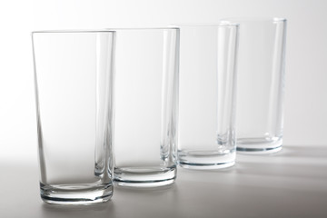 four glasses on white background