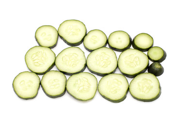 cutting cucumber on white