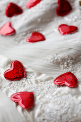 Fototapeta na wymiar Sparse hearts on wedding dress
