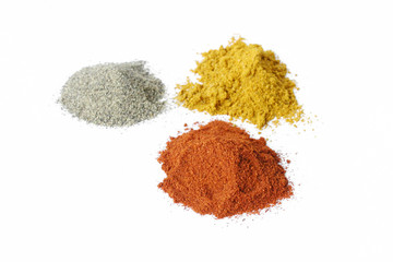 three piles of spices