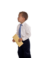 Young boy dressed as businessman holds envelope - isolated on wh