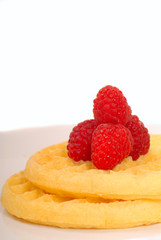 Breakfast waffles with fresh raspberries on top