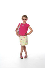 Cute girl in sunglasses, pink shirt and patterned skirt