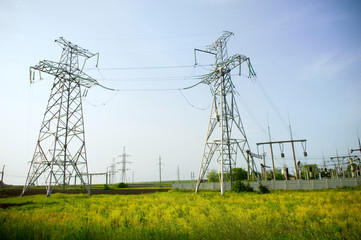 Two electrical towers on blue sky background