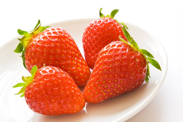 strawberries on white plate